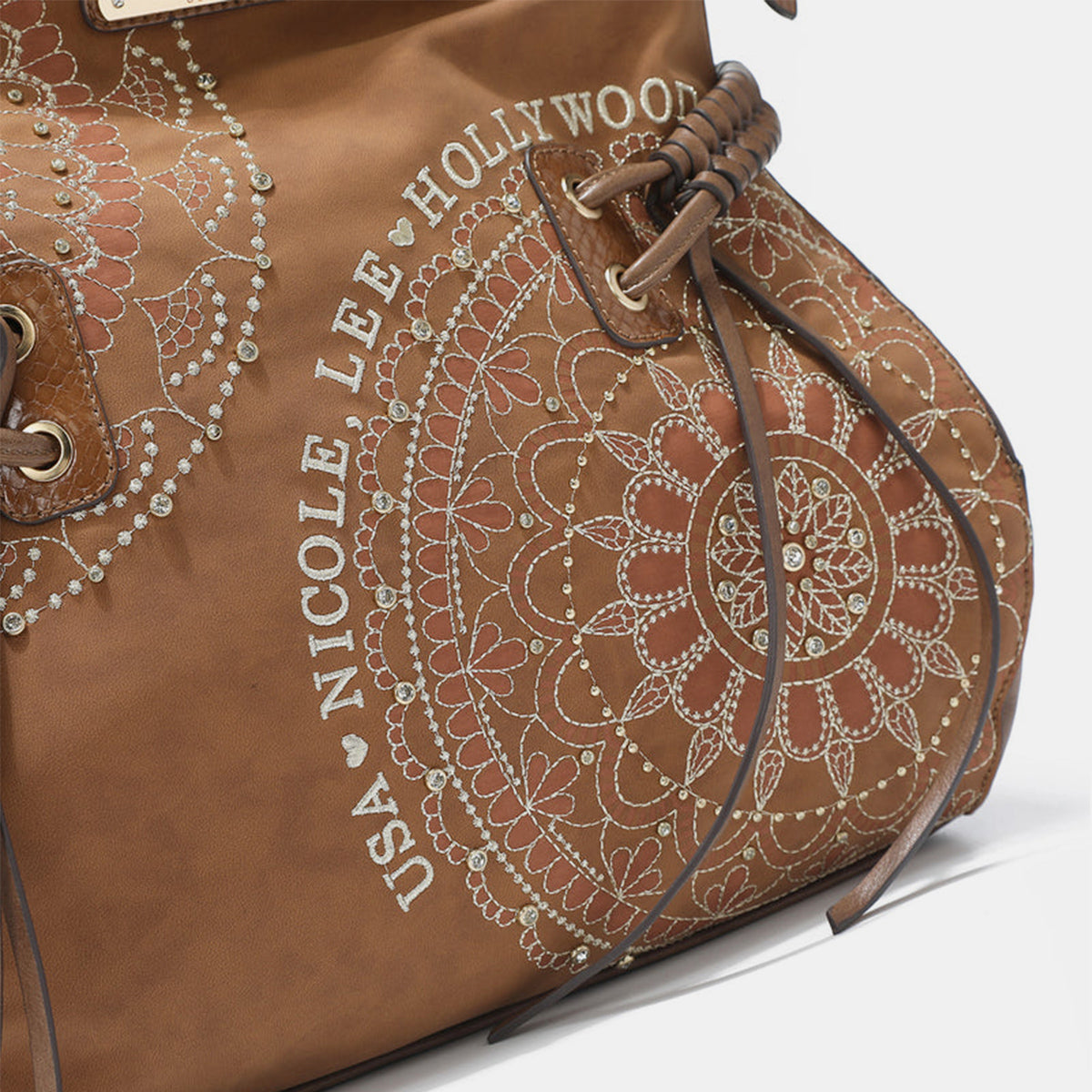 Hobo Bag- Sparkle, Tassel, Repeat; Meet Your New Go to Vegan Hobo Bag
Cruelty-Free never Looked this good! Tassels, rhinestones, embroidery. The unique patterns in this women's hobo bag align with the eclectic, artistic spirit of boho style. The unstructured design offers laid-back, carefree vibe of boho fashion. If you would like to transition seamlessly from day to night, beach to city, or festival to café, grab this bag!