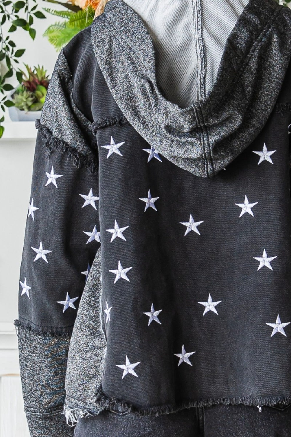 The Star Embroidered Hooded Denim Jacket combines a touch of whimsy with a whole lot of edginess to your wardrobe. Mis-matched materials with raw hem create a textured and eclectic eye-catching denim jacket. (We love this detail BTW). Whether you wear it with jeans for a casual look or layer it over a dress for a more edgy vibe, the Star Embroidered Hooded Denim Jacket is a versatile choice.