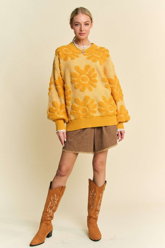 Flower Texture Sweater- The Golden Charm Double-Take. We call this the "Double Take" sweater for a reason. The stunning gold and rich texture are guaranteed to turn heads. The flower texture dropped shoulder sweater is a stylish and comfortable choice for your cool-weather wardrobe. The textured floral pattern is the star of this sweater giving a warm feminine touch. Whether you're heading to work or out for a weekend brunch, this sweater shows off your artistic side while feeling cozy.
