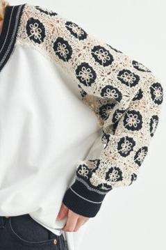 Crochet Contrast Stitching V Neck Top -ivory. The Crochet Contrast Stitching V-Neck Top is a feminine top that features intricate crochet detailing and contrasting stitching along the neckline.
Perfect for adding a touch of bohemian charm to your outfit.
V-neck design adds a flattering silhouette.