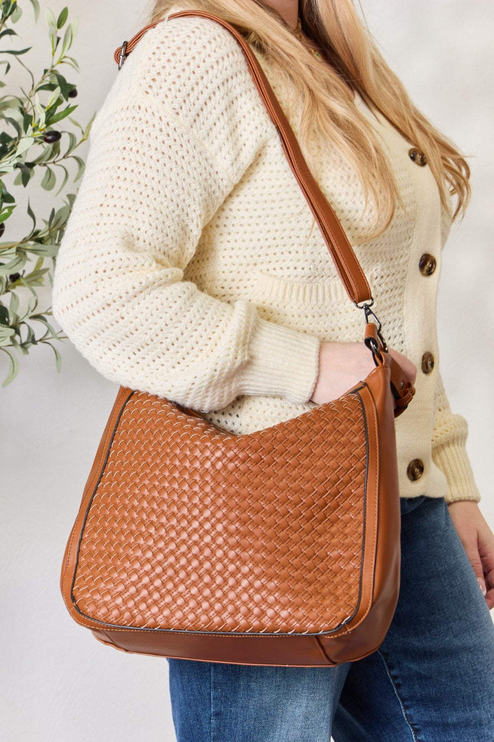 Weaved Vegan Leather Handbag- "Finally, a Bag That Gets You – Cruelty-Free, Boho, and Fabulous!"
advanced vegan leather: refers to a more sophisticated or high-quality alternative to traditional leather made without animal products; Vegan leathers that are crafted with innovative, sustainable materials or processes, designed to mimic the look, feel, and durability of real leather, but with a smaller environmental footprint.