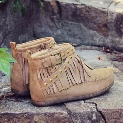 Step into the spirit of adventure with these Fringe Studded Suede Flat Boots. Designed for the free-spirited woman who craves comfort and style, these boots blend western ruggedness and bohemian flair. With soft, rich suede, fringed accents flowing with every step, bold rivets adorning the straps, these cowboy booties have a rebellious sparkle that are available in several earthy tones. Just right for a woman not afraid to make a statement.