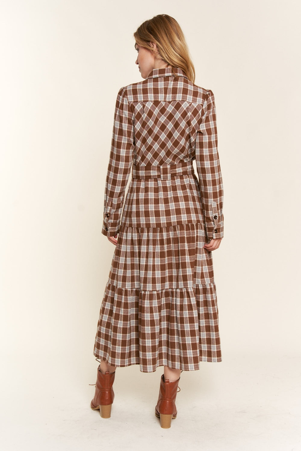 Tiered Midi Shirt Dress -Plaid to Meet You. If you're drawn to the dreamy world of boho, farmcore, or cottagecore, this feminine, prairie-style plaid dress is calling your name. Picture this: flowy fabric that feel like a gentle breeze, vintage-inspired details that make you feel like you've stepped out of a secret garden, and a timeless plaid pattern that just never goes out of style.