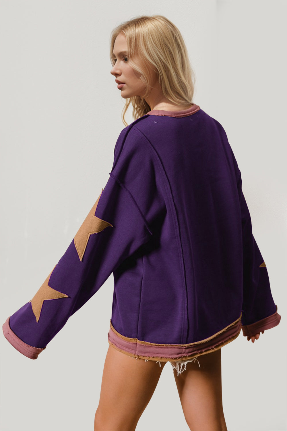 Boho Western Star Patch Sweatshirt – A Little Dust, A Lot of Stars. Add some star power to your sweatshirt collection with this long-sleeve star patched sweatshirt. Made from super-soft cotton, it’s got that laid-back vibe with a slouchy fit, oversized star details, and raw trim for a little extra edge. Whether you’re layering or wearing it solo, this sweatshirt brings effortless cool to any outfit!
