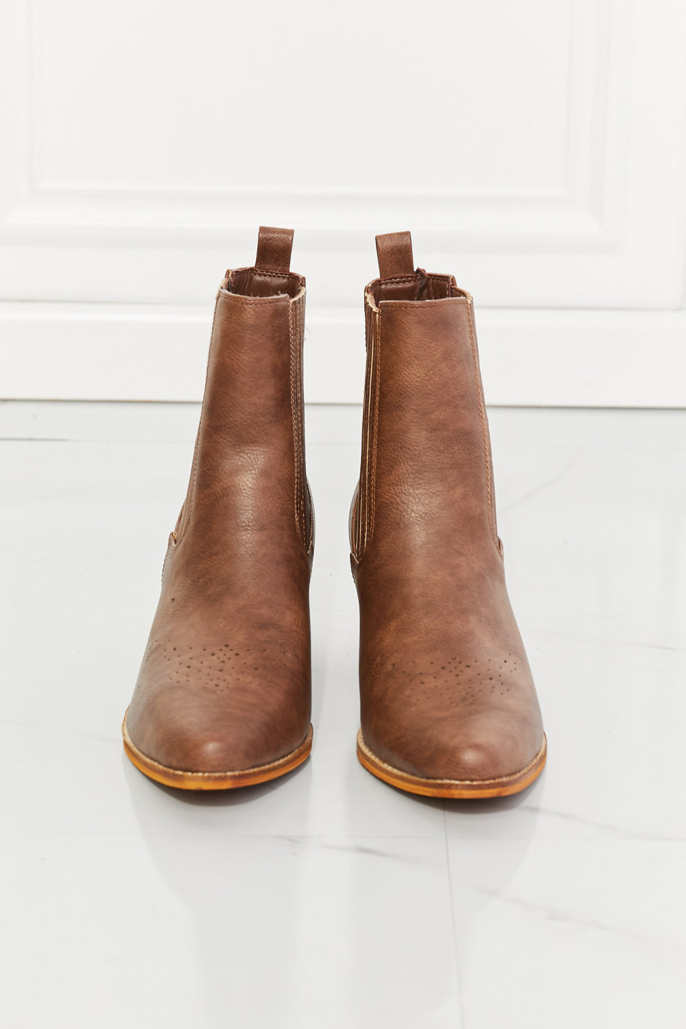 These boots are a balancing act between cowboy boots and Chelsea boots, featuring details of each style. They have a high-top and a stacked heel, as well as an elevated Chelsea panel and pointed toe. You can rock these stacked boots a pair of jeans, a leather jacket, or even a sharp suit. And with their sturdy construction and timeless design, these boots aren't just an accessory—they're an investment in style.