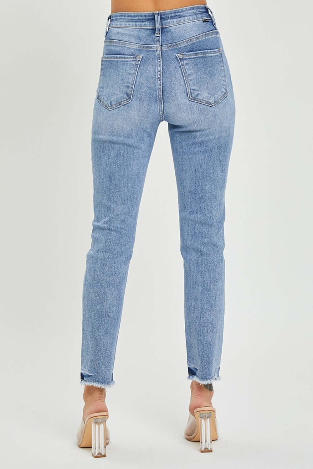 RISEN High Rise Skinny Jeans Frayed Hem with Plus Sizes 0-3x. Comfortable versatile pair of women's high rise skinny jeans perfect to show off your curves! Light Wash.