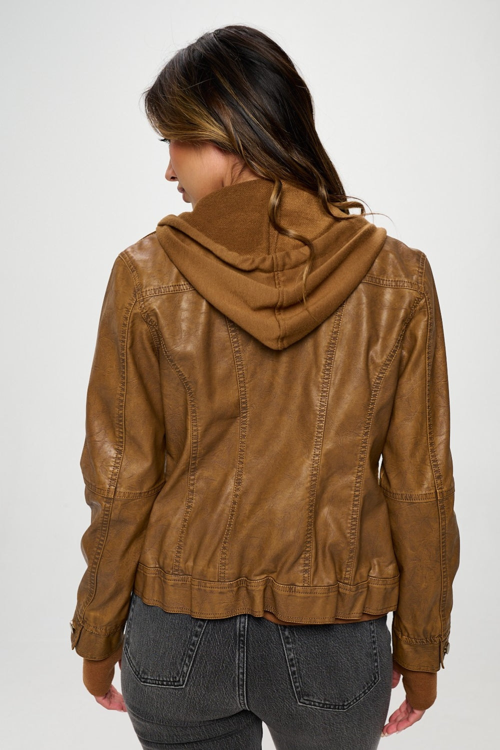 Check out the beautiful camel shade in this doble zip vegan leather jacket. Pair it with your favorite jeans or leggings for a casual and chic look.