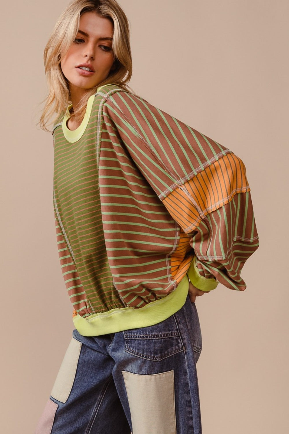 Oversized Sweatshirt -The Bold Mix Sweatshirt – Dare to Be Different. Bold, vibrant, and impossible to ignore—this oversized color block and striped sweatshirt is made for the free spirit who isn’t afraid to stand out. With its striking mix of daring hues, it’s more than just a sweatshirt; it’s a statement. Whether you're layering it or rocking it solo, this eye-catching piece is sure to turn heads and add energy to any look. Don’t wait—this one will move fast, and you won’t want to miss out on this!
