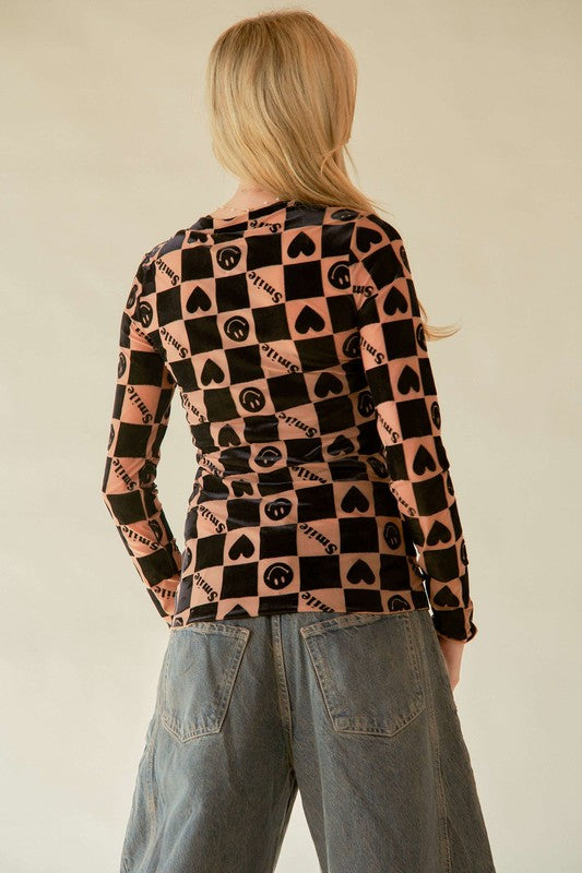 The Heart Print Long Sleeve Top is a charming and playful addition to your wardrobe. The heart print adds a sweet and feminine touch.&nbsp; Like to wear hearts for Valentines, but want something other than pink?&nbsp; Then this top&nbsp;rocks a style that matches better to your individuality! It is ideal for layering under jackets or cardigans. Pair it with jeans or skirts for a fun and romantic look that is perfect for any casual outing.


STOCK IS VERY LIMITED....GET YOURS SOON!