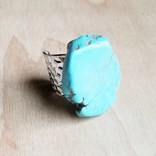Simulated Turquoise chunky stone sits on top of a silver-plated setting showing off its rustic charm!

Approx. 35mm

SHOUTOUT:
Adjustable to a variety of sizes
Although your item will resemble the photo,
each piece is created by hand, so no two are identical.