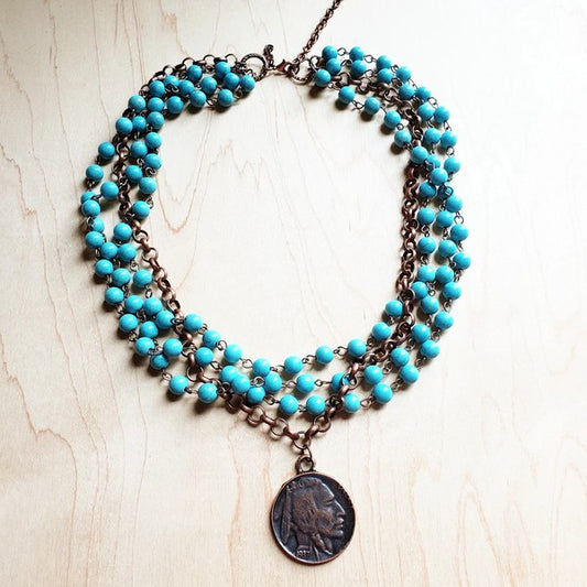 This turquoise necklace has a fun-loving spirit ideal for bohemian statement jewelry with a classic beauty. The end product is one of our absolute favorite necklaces. Whether you choose to wear it with your favorite jeans and t-shirt or you are looking for the finishing touch to a flowy dress and jean jacket, this necklace is a fantastic option. Layer this collar length necklace with longer pieces or let it stand alone. simulated turquoise chain and antique copper necklace is accented with an Indian Coin.  