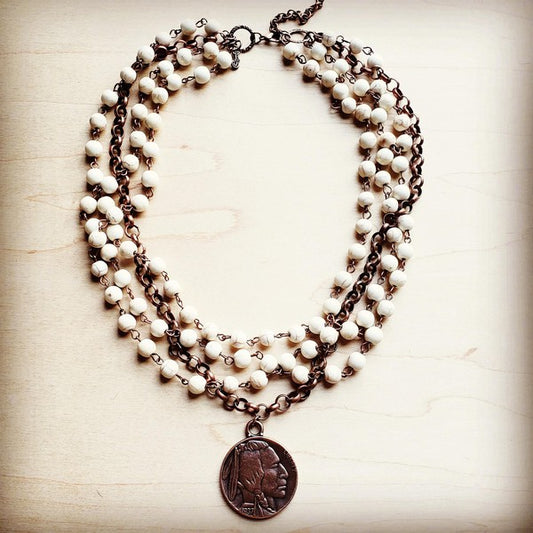 This white turquoise necklace has a fun-loving spirit ideal for bohemian statement jewelry with a classic beauty. The end product is one of our absolute favorite necklaces. Whether you choose to wear it with your favorite jeans and t-shirt or you are looking for the finishing touch to a flowy dress and jean jacket, this necklace is a fantastic option. Layer this collar length necklace with longer pieces or let it stand alone. This simulated turquoise chain and antique copper necklace is accented 