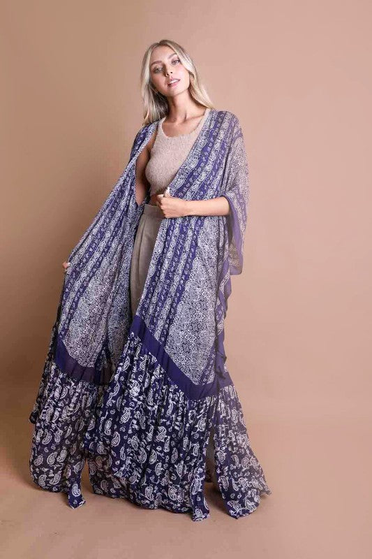 This sheer kimono is your ideal companion when you want to feel like you’re floating through life. Designed for the woman who loves to layer with ease and grace! This free flow Kimono stands out from others as it goes from a minimalist top and transitions beautifully into a rich paisley print as it flows toward the hem, creating a look that’s both modern and timeless. The oversized fit and mid-length sleeves add to the laid-back, breezy vibe, making it the ultimate piece for both lounging and living. 