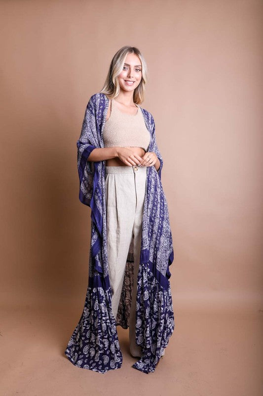 This sheer kimono is your ideal companion when you want to feel like you’re floating through life. Designed for the woman who loves to layer with ease and grace! This free flow Kimono stands out from others as it goes from a minimalist top and transitions beautifully into a rich paisley print as it flows toward the hem, creating a look that’s both modern and timeless. The oversized fit and mid-length sleeves add to the laid-back, breezy vibe, making it the ultimate piece for both lounging and living. 