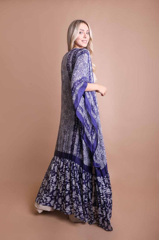 This sheer kimono is your ideal companion when you want to feel like you’re floating through life. Designed for the woman who loves to layer with ease and grace! This free flow Kimono stands out from others as it goes from a minimalist top and transitions beautifully into a rich paisley print as it flows toward the hem, creating a look that’s both modern and timeless. The oversized fit and mid-length sleeves add to the laid-back, breezy vibe, making it the ultimate piece for both lounging and living. 