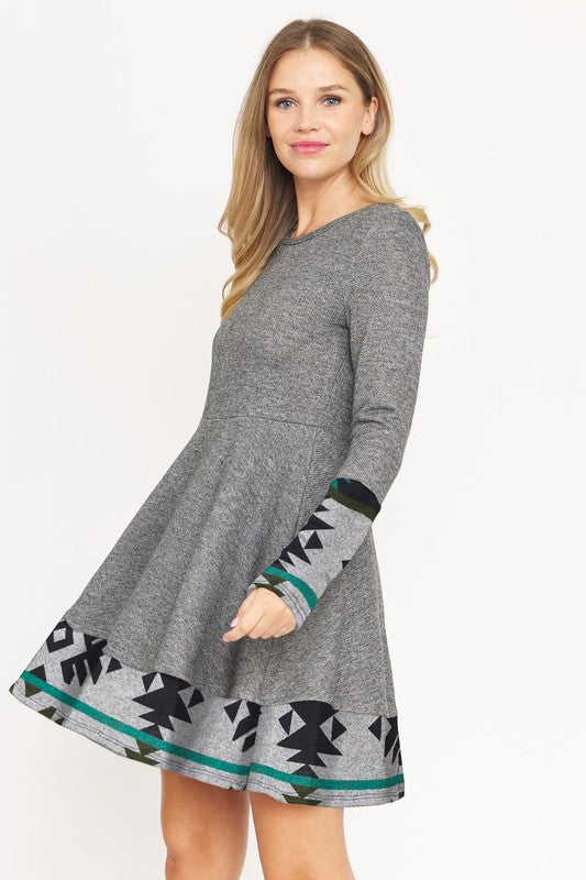 Layered Fit and Flare Dress- "Flatter Every Curve, Own Every Moment!.  This dress transition easily between settings, from office to party attire, with the right accessories! Pair with your favorite boots. This flared dress is both cozy and chic.  Aztec trim.