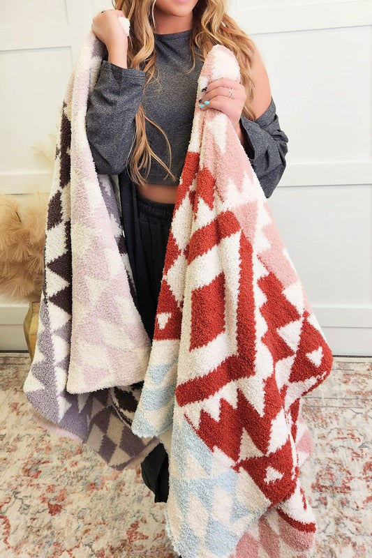 This blanket is the definition of cozy! It's warm and soft, perfect for snuggling up with on a chilly night. Great for gifts too! The rust colors pair well with the other colors!