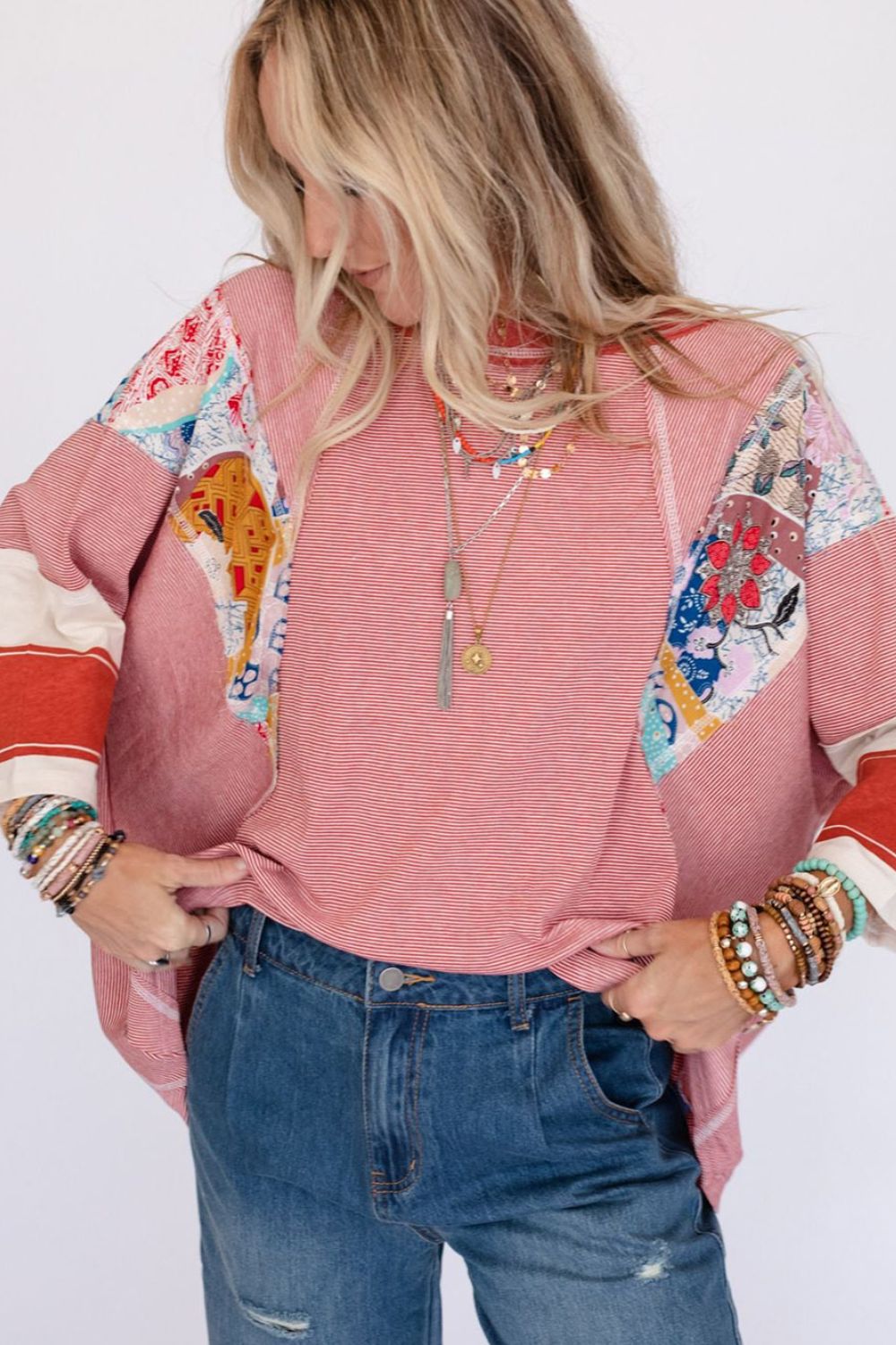 Feel your individuality showcased as you wear PERFECT boho top! This oversized 3/4 sleeve has vintage-inspired floral patches and a blend of vibrant colors. This oversized top is made for those who crave comfort and creativity. The oversized stripes and vintage style blooms create a one-of-a-kind, artsy vibe that’s as laid-back and free-spirited as you are. Whether you’re lounging or adventuring, in this top you can feel confident, carefree, and ready to embrace whatever comes your way!