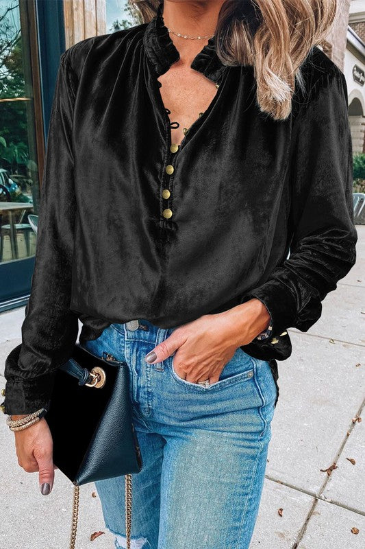 This luxurious velvet blouse is soft, skin-friendly, and lightweight, offering both comfort and elegance. Featuring a classic V-neck, button design, and feminine frilled neckline, it adds a timeless touch to your wardrobe. Perfectly paired with jeans, leggings, skirts, or boots, this versatile top is ideal for any occasion—whether casual, office, or a night out.. Several stunning colors available. All you need to do is pick!