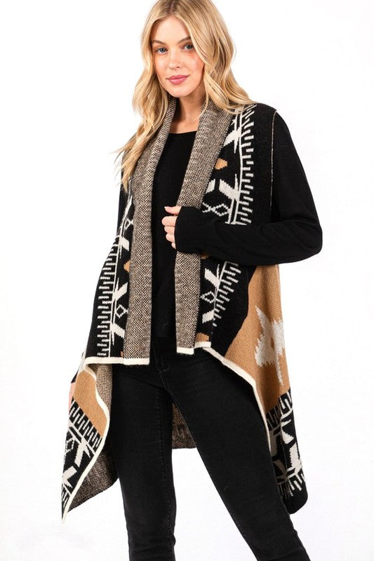 Ready to elevate your boho western style? This Aztec vest is designed to flatter every body shape with a tailored fit that moves with you, offering both comfort and flow. The black, tan, and white Aztec print creates a bold yet timeless look that pairs perfectly with leggings or jeans. Its high-low hem gives you the freedom to dress it up for a night out or keep it casual for a day on the go. Your wardrobe is waiting!