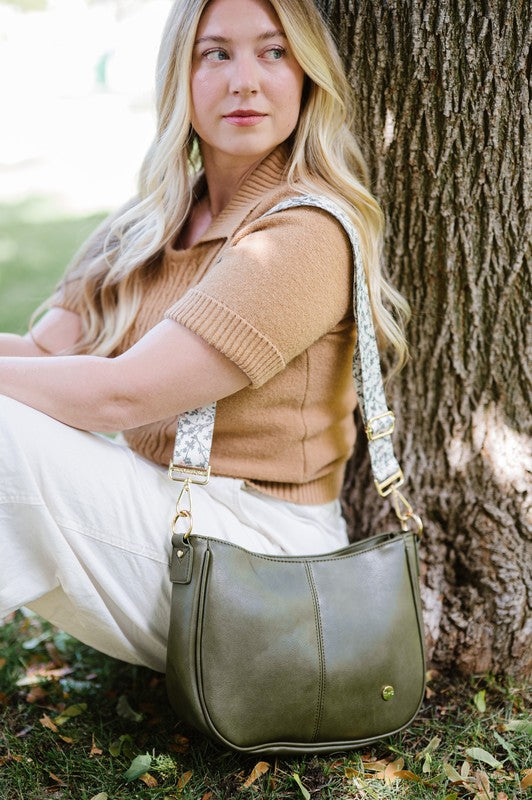 Free Spirit Carryall: Vegan Handbag & Crossbody in Olive with Bonus Straps The Bundle includes a bohemian style crossbody in Olive WITH strap. It also comes with two additional straps:&nbsp; The Evie Strap, and the Garden Party strap. The added interchangeable straps add extra value and can seamlessly change from a handbag to a crossbody! You will also have a stunning VEGAN crossbody made of buttery soft vegan leather and glossy hardware.