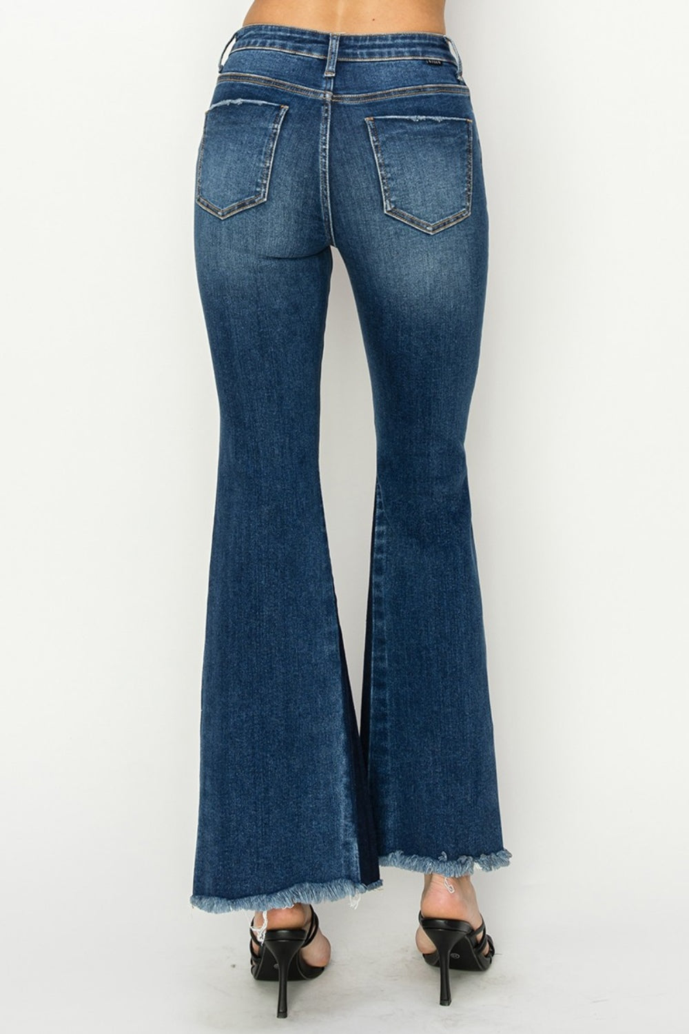 RISEN High Rise Jeans - Holy Grail Boho Split Flares.  Holy Grail of features you need and love!. Unique SLIT Flare! Imagine how you can show off your fav pair of boots, shoes, or sneakers creating a statement style!. 
 The shadow slit creates a double-take detail standing out anywhere and everywhere.  Can't wait for you to slide these on and have the look and confidence you love at your next event or while kicking back.  Medium Wash