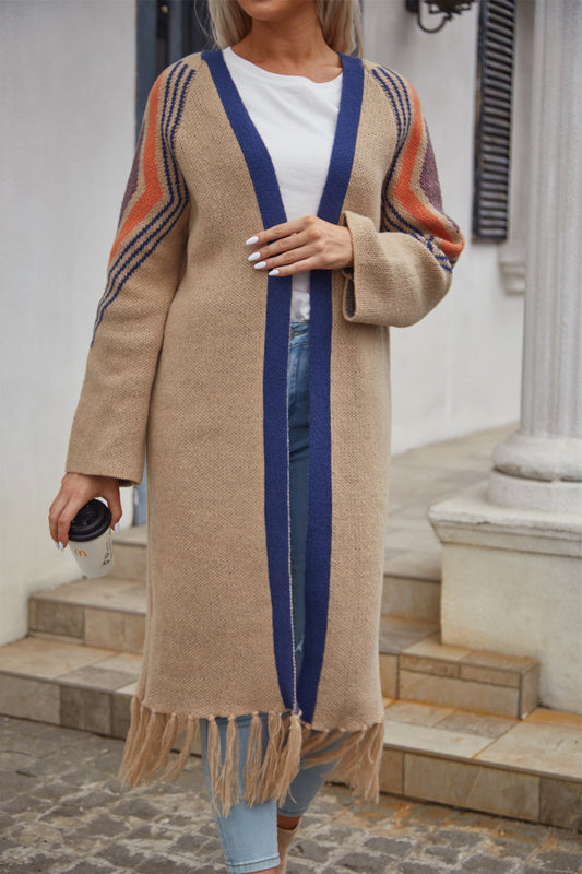 Long Fringe Cardigan- "Western Winds Boho Duster- A Layering MVP".  Do you love the boho-western style? Do you love layers you can use in any season? You are in the right spot! Wrap yourself in comfort and style that feels as free as the open road. This open-front cardigan with its striking geometric accents and fringe detailing is the perfect mix of earthy charm and boho spirit. The perfect topper for every season – layer it, love it, and never look back.