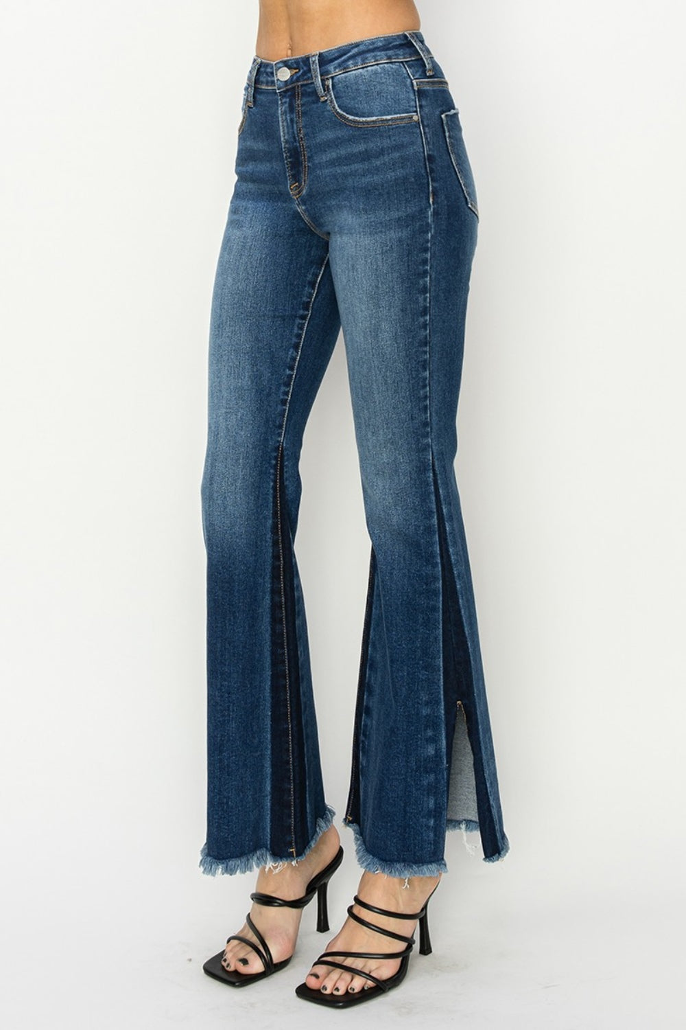 RISEN High Rise Jeans - Holy Grail Boho Split Flares.  Holy Grail of features you need and love!. Unique SLIT Flare! Imagine how you can show off your fav pair of boots, shoes, or sneakers creating a statement style!. 
 The shadow slit creates a double-take detail standing out anywhere and everywhere.  Can't wait for you to slide these on and have the look and confidence you love at your next event or while kicking back.  Medium Wash