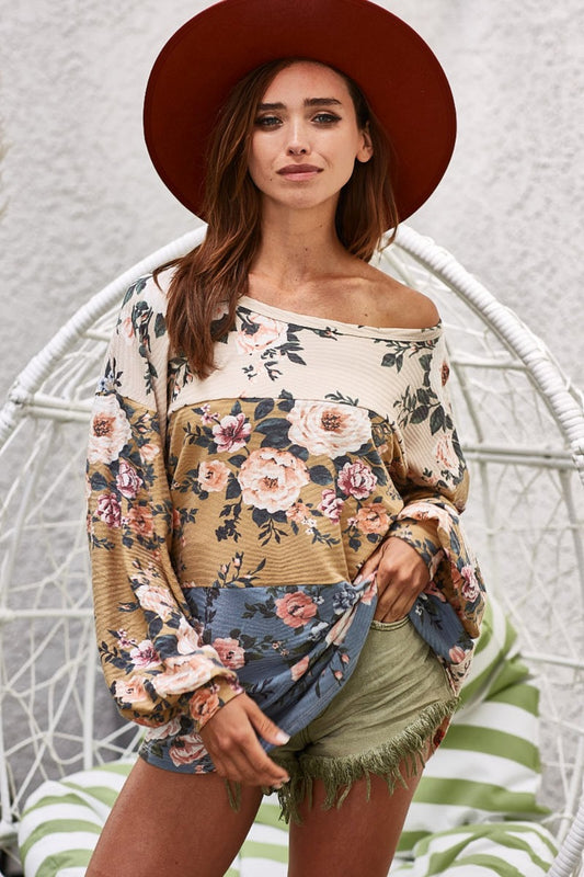 This floral jacquard color-block top is a staple for those who value style with soul. The delicate floral pattern brings a touch of feminine and timeless style while the bold color-blocking adds a modern twist that’s sure to turn heads and sets it apart from other tops. Pair it with your favorite jeans or a flowy skirt, and you’ve got a look that’s effortlessly chic, just like the open road.