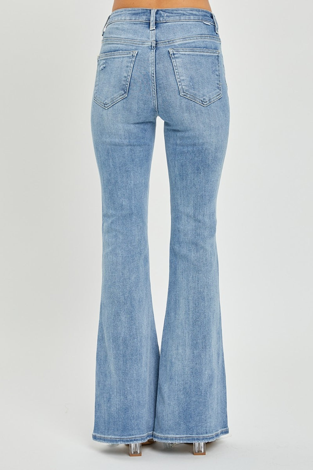 Risen High Rise Flared Jeans / Frayed Hem & Plus Sizes.   Perfect blend of classic retro vibes and iconic flair that never goes out of style!  Light Wash