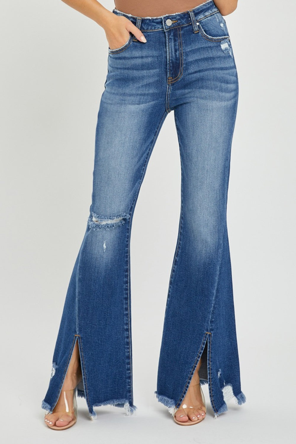 RISEN Full Size High Rise Front Slit Frayed Hem Flare Jeans.  These jeans have a unique SLIT Flare! Check them out!  Imagine how you can show off your fav pair of boots, shoes, or sneakers creating a statement style! These double-take details will stand out anywhere and everywhere! Medium wash.