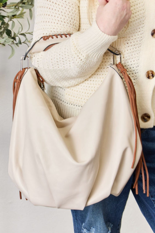 Get ready to crush on the ultimate cruelty- free Bohemian vegan leather hobo handbag! Designed for the free-spirt with a kind heart -add the perfect guilt-free accessory your wardrobe has been waiting for!

The women's hobo bag with fringe detail gives you a style that you can look this good without even trying!;


