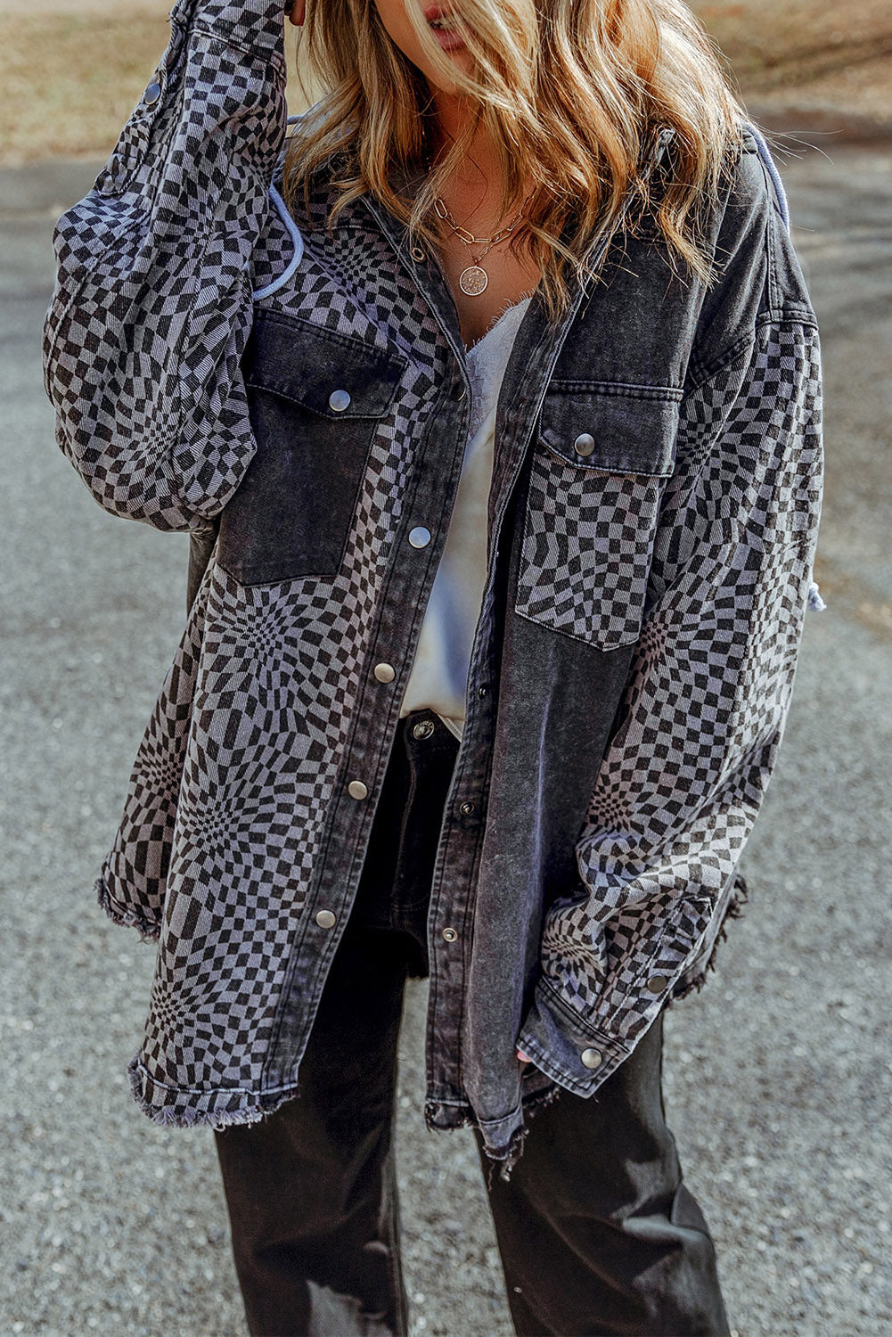 Going tailgating, or to a farmer's market on a cloudy day and need a warmer layer? Add this to your cart! This patchwork pattern combined with functionality (you know... the hood, drawstring, and pockets) make this a wardrobe "go-to". What if it had some vintage inspired features? The black denim wash with the raw edges creates a bit of a vintage and laid-back vibe. We can't wait for you to enjoy it!