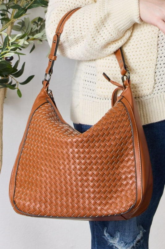Weaved Vegan Leather Handbag- "Finally, a Bag That Gets You – Cruelty-Free, Boho, and Fabulous!"
advanced vegan leather: refers to a more sophisticated or high-quality alternative to traditional leather made without animal products; Vegan leathers that are crafted with innovative, sustainable materials or processes, designed to mimic the look, feel, and durability of real leather, but with a smaller environmental footprint.