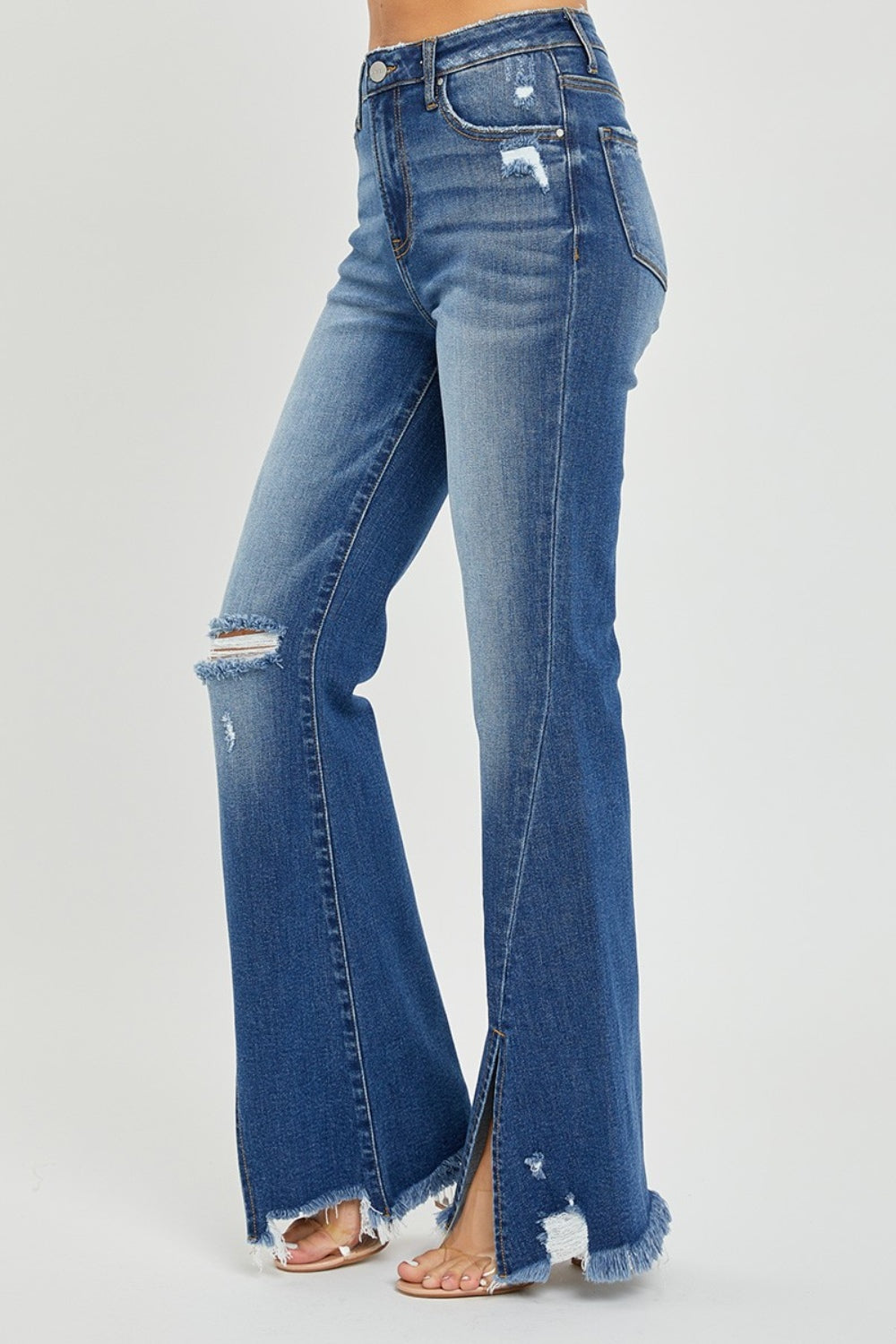 RISEN Full Size High Rise Front Slit Frayed Hem Flare Jeans.  These jeans have a unique SLIT Flare! Check them out!  Imagine how you can show off your fav pair of boots, shoes, or sneakers creating a statement style! These double-take details will stand out anywhere and everywhere! Medium wash.