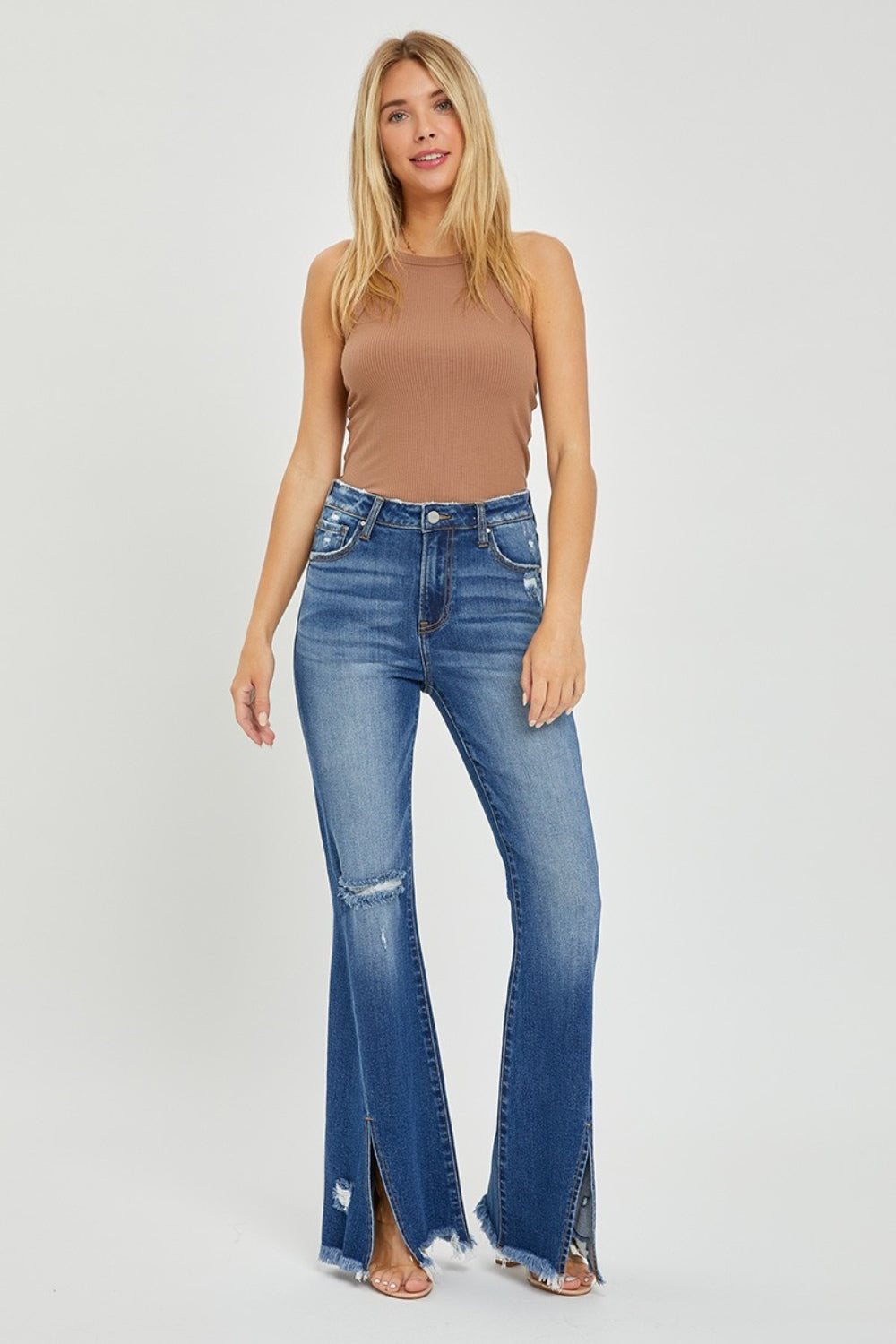 RISEN Full Size High Rise Front Slit Frayed Hem Flare Jeans.  These jeans have a unique SLIT Flare! Check them out!  Imagine how you can show off your fav pair of boots, shoes, or sneakers creating a statement style! These double-take details will stand out anywhere and everywhere! Medium wash.