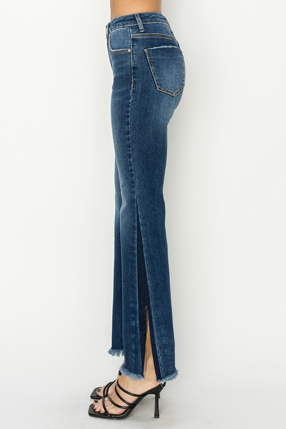 RISEN High Rise Jeans - Holy Grail Boho Split Flares.  Holy Grail of features you need and love!. Unique SLIT Flare! Imagine how you can show off your fav pair of boots, shoes, or sneakers creating a statement style!. 
 The shadow slit creates a double-take detail standing out anywhere and everywhere.  Can't wait for you to slide these on and have the look and confidence you love at your next event or while kicking back.  Medium Wash