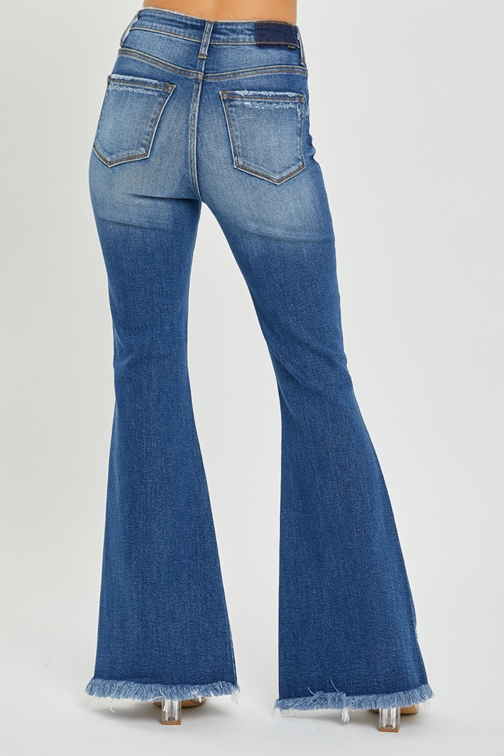 RISEN Full Size High Rise Front Slit Frayed Hem Flare Jeans.  These jeans have a unique SLIT Flare! Check them out!  Imagine how you can show off your fav pair of boots, shoes, or sneakers creating a statement style! These double-take details will stand out anywhere and everywhere! Medium wash.