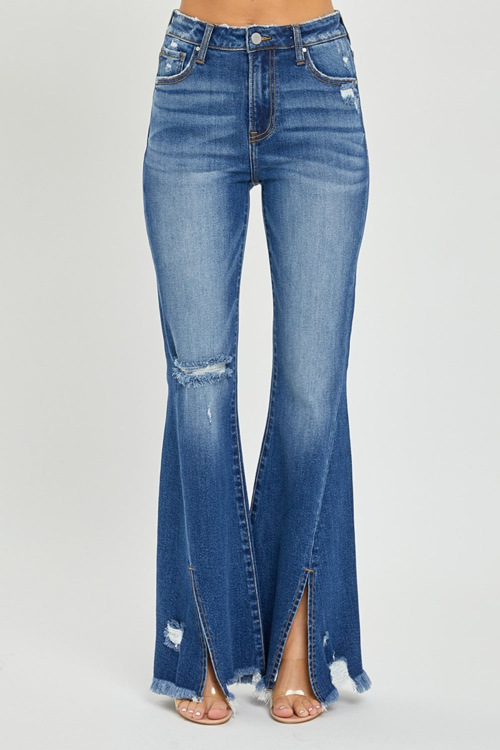 RISEN Full Size High Rise Front Slit Frayed Hem Flare Jeans.  These jeans have a unique SLIT Flare! Check them out!  Imagine how you can show off your fav pair of boots, shoes, or sneakers creating a statement style! These double-take details will stand out anywhere and everywhere! Medium wash.