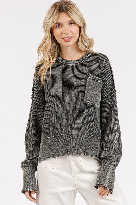 The distressed hem sweater is a relaxed essential for your casual wardrobe. The dropped shoulder design adds a laid-back vibe, while the distressed hem detail gives it a cool and edgy look. The soft knit fabric ensures comfort all day long. Pair it with your favorite jeans or leggings for an effortless ensemble perfect for everyday wear.