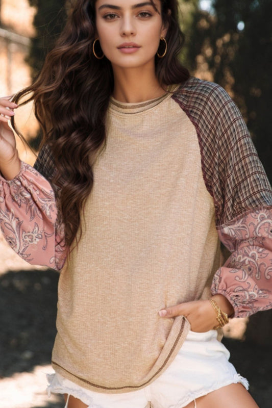 Unconventional pullover with contrast sleeves. The rustic plaid paired with the floral creates a charm that shows off individuality. Feel great wearing this feminine top out to the farmers market, while out looking for quirky cafes, vintage or antique shops to cultivating your garden, art exhibitions, or outings with friends.