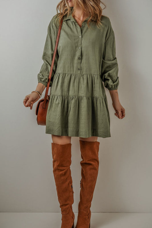 Feel the way this dress moves, (loose and flowy) and you will feel ready to start your day! The tiered style and army green creates a flattering dress that is equal parts free-spirited and laid-back western. The textured ruching along the seams creates a subtle, rippling effect that adds a touch of character to the flowy silhouette. Balloon sleeves bring a playful, whimsical vibe. Designed for comfort and breathability, this dress is perfect for those sunny afternoons or casual get-togethers.