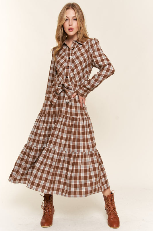 Tiered Midi Shirt Dress -Plaid to Meet You. If you're drawn to the dreamy world of boho, farmcore, or cottagecore, this feminine, prairie-style plaid dress is calling your name. Picture this: flowy fabric that feel like a gentle breeze, vintage-inspired details that make you feel like you've stepped out of a secret garden, and a timeless plaid pattern that just never goes out of style. 
