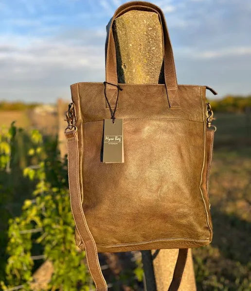 Looking for a quality, classic leather bag? This handbag is timeless and would surely be an essential handbag for your everyday work or pleasure! Join the Lucky Few—Only a Handful Available!  *Please note that lighting can affect how the color appears, so the bag may look slightly different in person. It actually has a lovely olive tone that adds a unique charm!